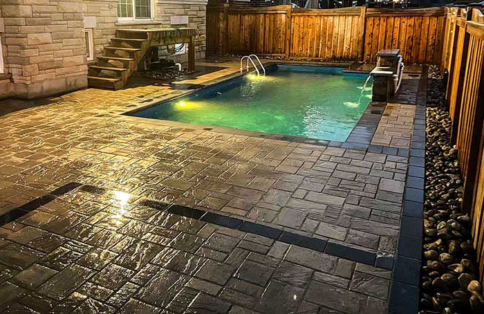 VanKuikConstruction-2024-backyard-interlock-stone-pool